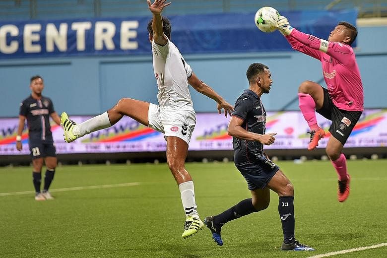 Warriors' goalkeeper Yazid Yasin saving a strike by Albirex Niigata's Kazuki Mine (far left). The Japanese team are on 47 points, seven ahead of second-placed Tampines Rovers who have one game in hand.