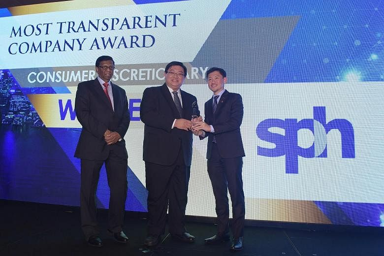 SPH deputy CEO Anthony Tan (right) receiving the award for the Most Transparent Company in the Consumer Discretionary category at the Sias Investors' Choice Awards yesterday. This marks the 12th time SPH has won this award. Mr Tan is accompanied by M