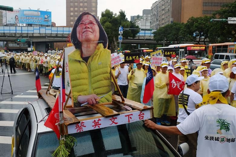 Workers in the tourism industry displaying their unhappiness with President Tsai Ing-wen during a protest in Taipei last month. 
