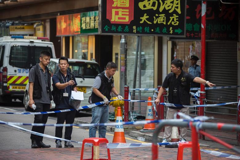 Hong Kong police fire shots in knife attack, three injured | The ...
