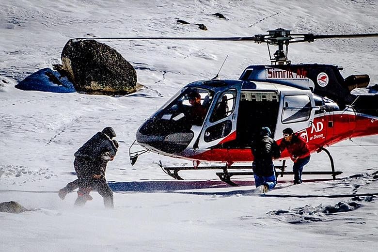 While climbing a mountain in Nepal, Mr Kow hurt his back in an accident and had to be airlifted to hospital. He credits his guides with saving his life as they cleared a spot for the helicopter to land and carried him to the aircraft. Nepalis taking 