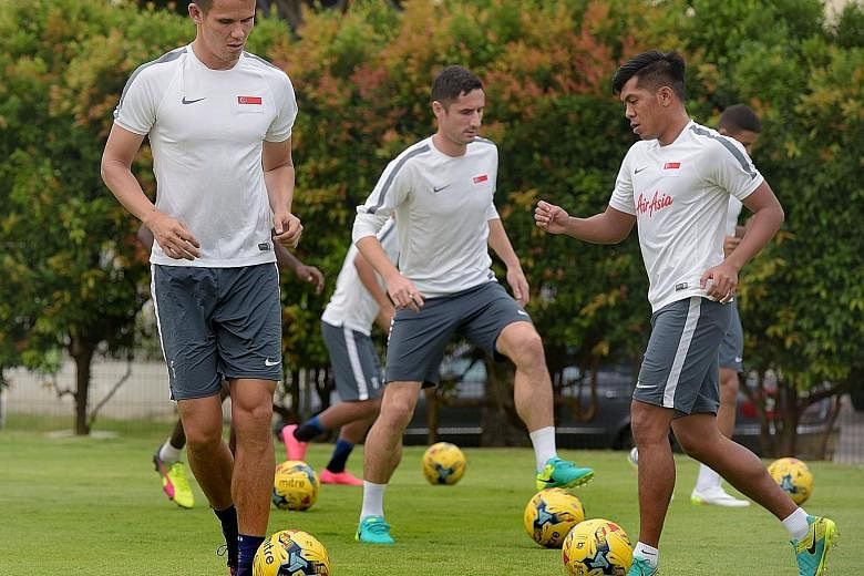 (From left) Baihakki Khaizan, Daniel Bennett and Khairul Amri at caretaker coach Sundram's first centralised training session ahead of two friendlies against Malaysia and Hong Kong. Irfan Fandi, son of local icon Fandi Ahmad, is in the senior squad f
