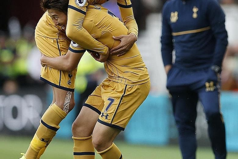 A wrestling move right out of the training ground? Not quite. But high-flying Tottenham have been reaping the rewards of Mauricio Pochettino's tough regimen, with Son Heung Min celebrating the first of his double with Dele Alli (lifted) in their 2-1 