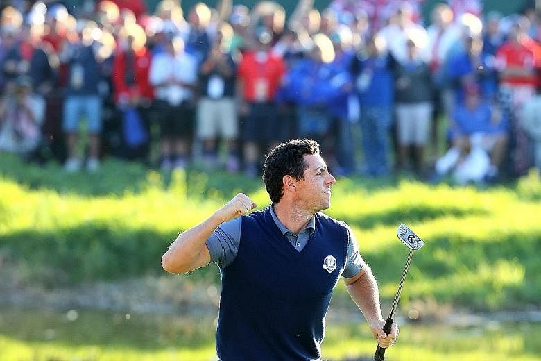 Rory McIlroy of Europe reacting on the 16th green after making a putt to win the match during afternoon four-ball matches of the Ryder Cup at Hazeltine National Golf Club on Friday.