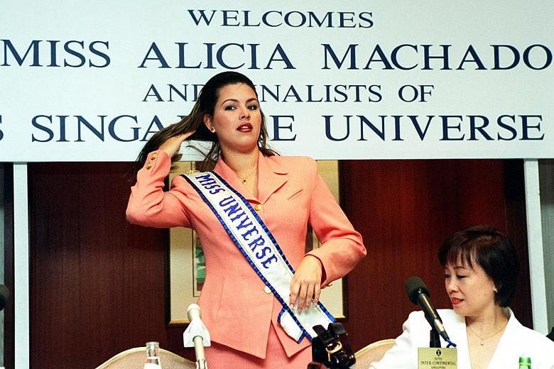 Miss Universe Alicia Machado at a press conference in Singapore in 1997. She defended her weight then, saying she wanted to show people that one could be beautiful "with a little more weight".
