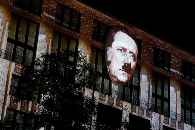 A video animation of Adolf Hitler during the Berlin Leuchtet festival on Friday, as part of a show that displays 150 years of the capital's history. The annual light festival in Berlin, Germany, runs from Sept 30 to Oct 16 this year.