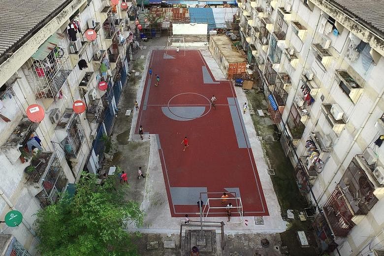 Think out of the box. Work round it and curl it if it works - in other words, bend it like Beckham. If a standard football pitch cannot be built, an asymmetrical pitch, like this one amid high-rise apartment buildings in the densely-inhabited Klong T