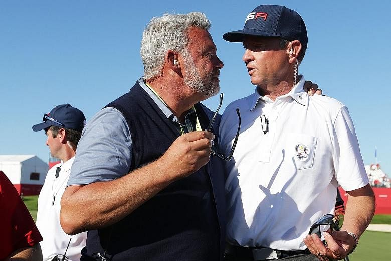 Ryder Cup European captain Darren Clarke (left) and counterpart Davis Love III of the United States embrace at Hazeltine National Golf Club. The US regained the Ryder Cup for the first time since 2008 with a 17-11 victory on Sunday.