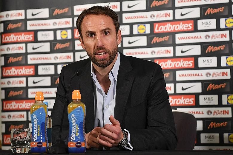 England interim manager Gareth Southgate giving a press conference ahead of England's World Cup qualifier against Malta. He believes that his captain Wayne Rooney can play in a number of different positions rather than solely as a striker.