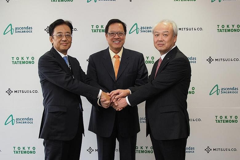 Ascendas-Singbridge Group has entered into a joint venture for the 79 Robinson Road project with Mitsui & Co and Tokyo Tatemono, as represented by (from left) Mr Nishimura, Mr Ko and Mr Tanehashi.