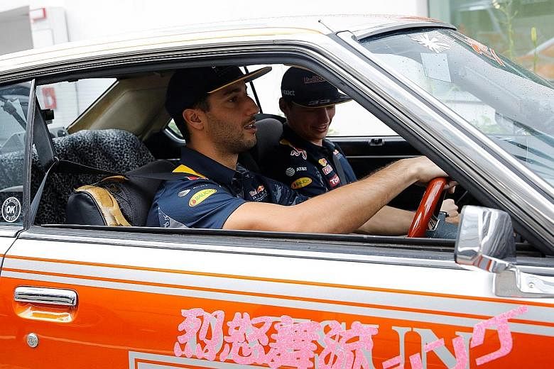Red Bull's Daniel Ricciardo (left) driving a 1979 Nissan Skyline with team-mate Max Verstappen in the passenger's seat. The Australian will be back in the RB12 at Suzuka for Sunday's Japanese Grand Prix.