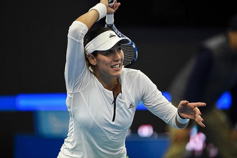Garbine Muguruza hitting a forehand against Czech Petra Kvitova of the Czech Republic during the women's singles third round of the China Open. The second-seeded Spaniard fell in straight sets.