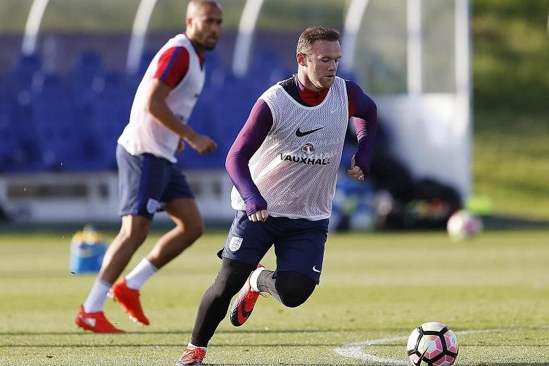 Wayne Rooney training at St George's Park with England. The 30-year-old, a substitute in Manchester United's last three games, believes he is best suited to play in midfield at this stage of his career.