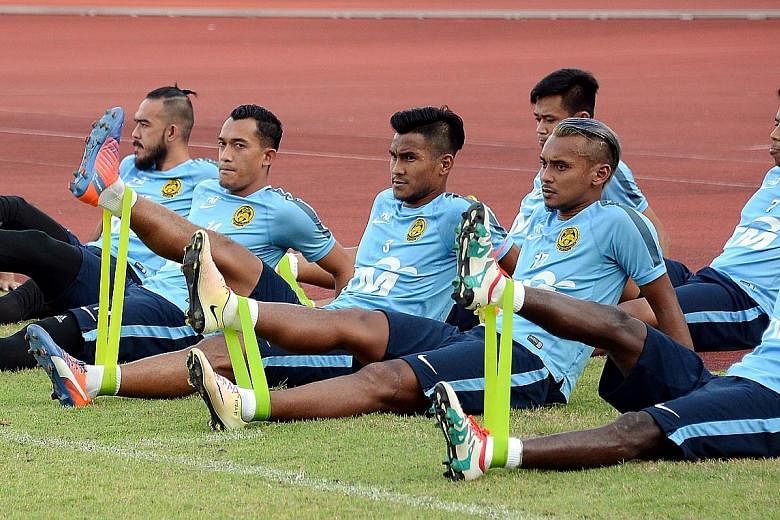 Malaysia captain, Amri Yahyah (front row, second from right) training with his team-mates at the Bishan Stadium ahead of tomorrow's Causeway Challenge.