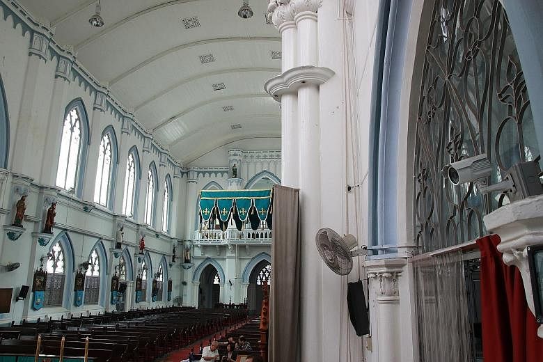 Places of worship, like St Joseph's Church (above) in Victoria Street and Masjid Muhajirin (left) in Braddell Road, have security cameras installed.