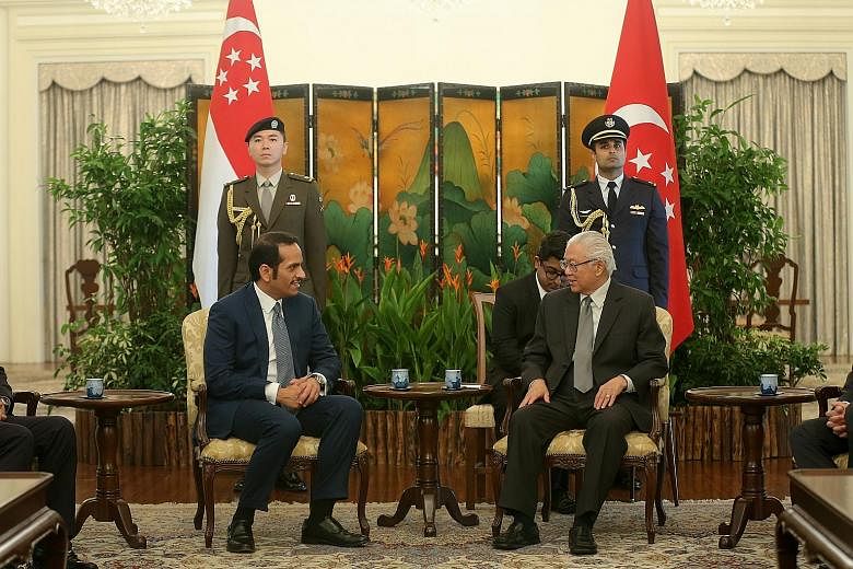 Qatar Foreign Minister Sheikh Mohammed bin Abdulrahman bin Jassim Al-Thani (seated, far left) with President Tony Tan Keng Yam at the Istana yesterday, where both sides reaffirmed the friendly ties between their countries.