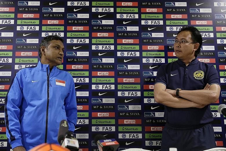 Lions caretaker coach V. Sundramoorthy and Malaysia boss Ong Kim Swee at yesterday's press conference at Amara Hotel. The duo are preparing for their second touchline battle, with Ong prevailing in the first.