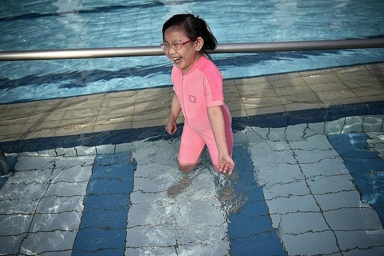 Lim En Xuan enjoying herself at a swimming complex on Monday. She could not go near a pool in the past because of fears of infection, but now that she has a new kidney, learning to swim is at the top of her to-do list.