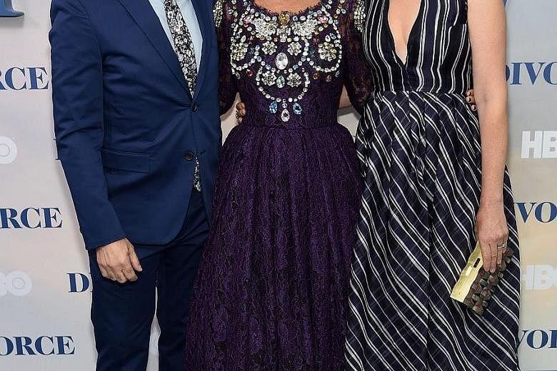 Actress Sarah Jessica Parker (centre) hinted that talks were under way for a third Sex And The City movie while at the premiere of her television series Divorce on Tuesday. "I described it as being not on the table, but in the warming drawer," she sa