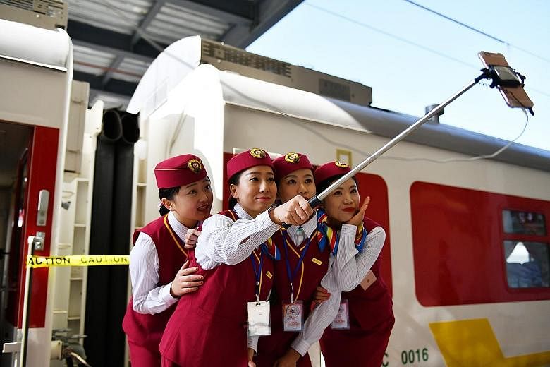 Chinese train attendants taking a wefie before the start of the Addis Ababa-Djibouti passenger rail service on Wednesday.