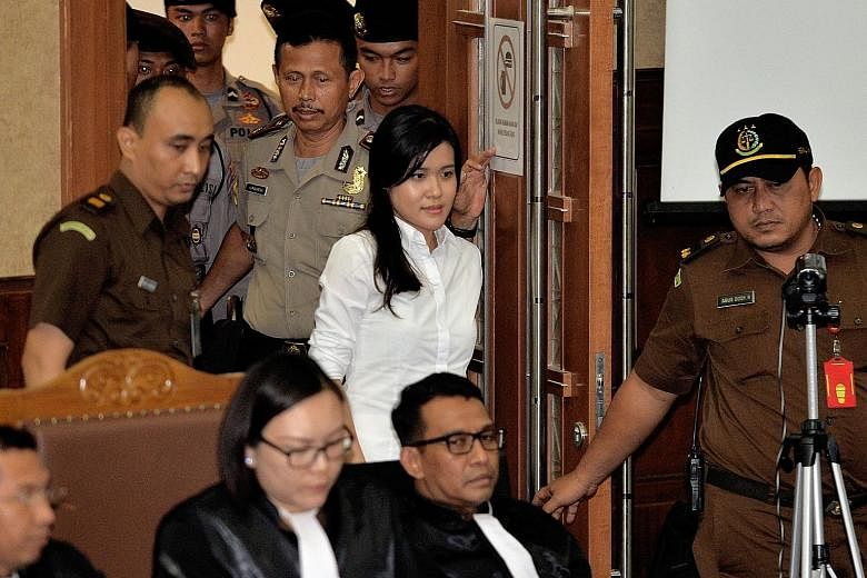Wongso entering the Jakarta courtroom to hear the indictment from the public prosecutor on Wednesday.