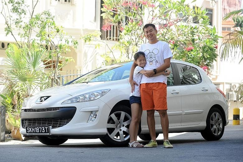 Physical education teacher Loke Kok Fei's interest in car grooming has rubbed off on his daughter Kayen, who helps him wash his Peugeot on weekends.