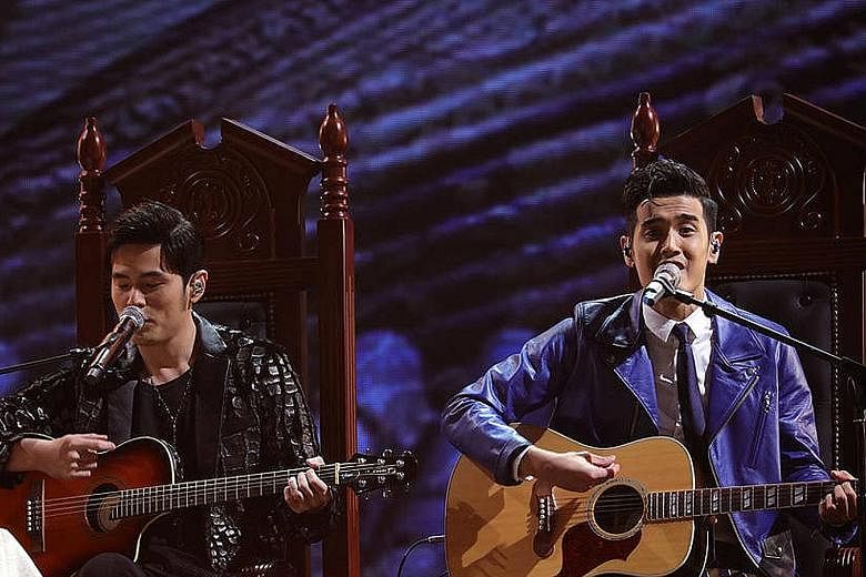 LEFT: Nathan Hartono (right) performing with his mentor Jay Chou at the Sing! China final yesterday. The Singaporean picked two of his mentor's classics - singing the Nunchucks rap hit with Chou and the Longest Movie ballad by himself. RIGHT: Winner 