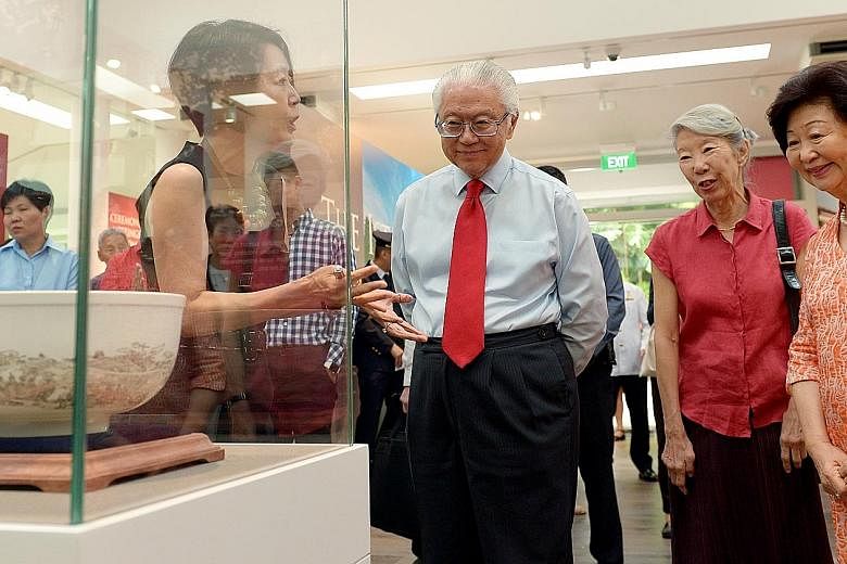 President Tan and his wife Mary with Ms Constance Sheares, daughter of former president Benjamin Sheares, on a tour of the gallery led by NHB's director of preservation of sites and monuments Jean Wee.