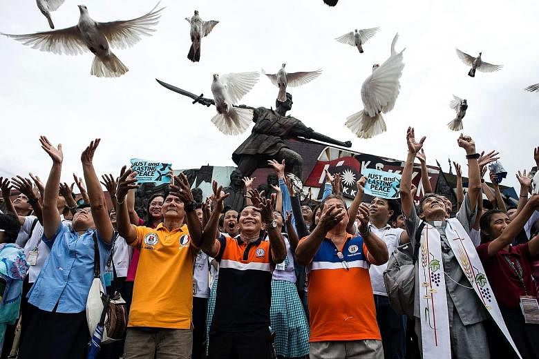 Filipino students and representatives from various organisations releasing 100 doves yesterday to mark President Duterte's first 100 days in office.