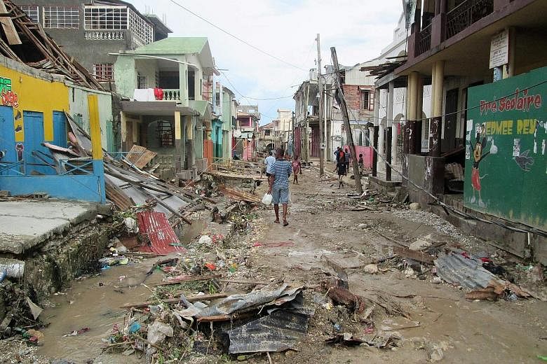 The damage wreaked by Hurricane Matthew in the town of Jeremie in west Haiti. The death toll in the country surged to at least 572 people yesterday.