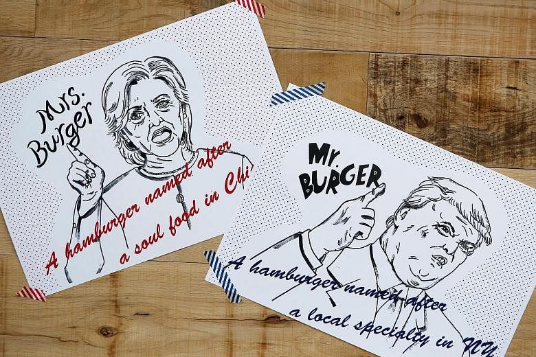 Posters depicting the presidential candidates as Mr and Mrs Burger in a burger cafe in Tokyo.