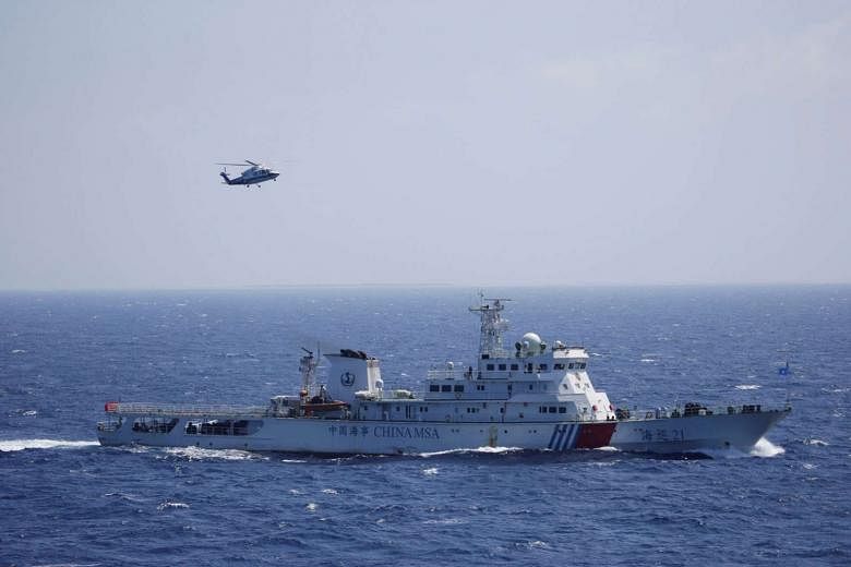 A Chinese ship and helicopter during an exercise in the Paracel Islands. China had pledged to finalise the framework for the Code of Conduct on the South China Sea by the middle of next year, but it remains to be seen whether this will translate into tang