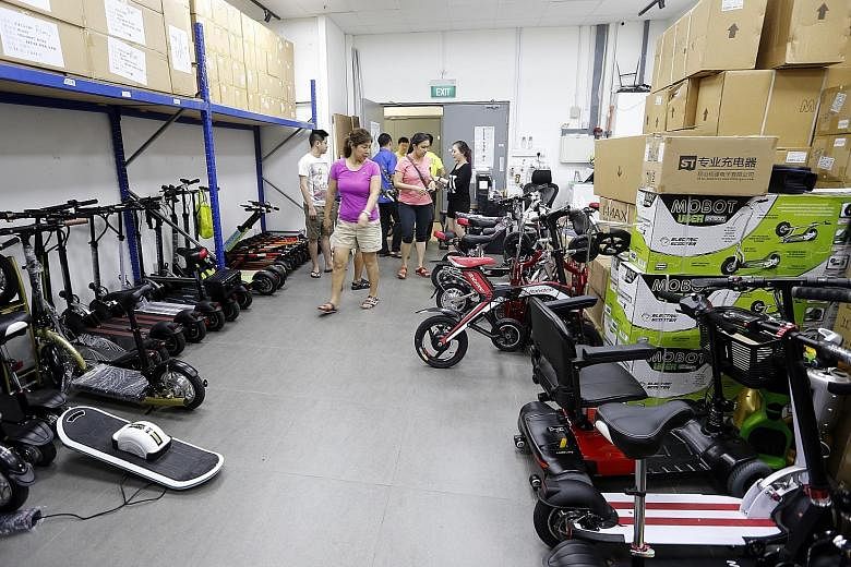 An array of mobility devices at Mobot's showroom in Ubi. The retailer says it sells more than 400 e-scooters a month, a 30 per cent increase since stricter e-bike rules took effect last December.