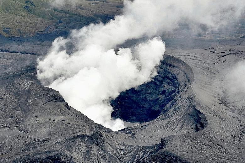An aerial view of Mount Aso erupting in Aso, Kumamoto prefecture, Japan yesterday. The Japan Meteorological Agency has raised the alert level for the volcano to level three on a scale of five.