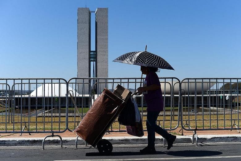 A street vendor walking past the National Congress during Brazilian President Dilma Rousseff's impeachment trial in August. The Brazilian equity market has seen a strong performance since her ouster.