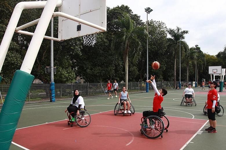 Able-bodied participants such as 16-year-old Jaslyn Song (centre, in light blue) had their chance to experience playing wheelchair basketball at the ROMP youth sports carnival.