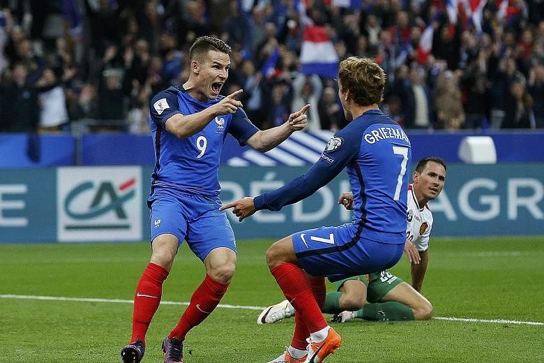 Two-goal hero Kevin Gameiro (left) celebrating his feat with strike partner Antoine Griezmann as France swept to a 4-1 win over Bulgaria.