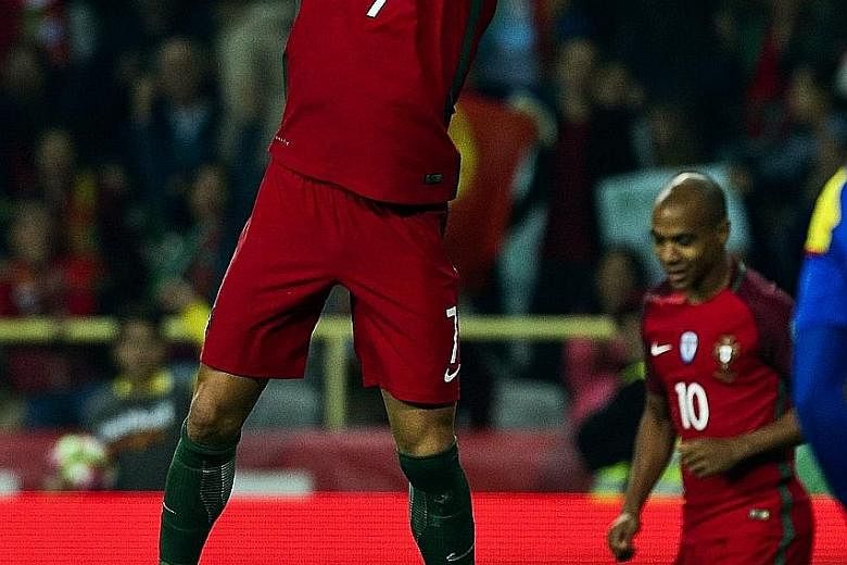 A familiar sight for Portugal fans, as Cristiano Ronaldo celebrates in his unique style after scoring four past Andorra. The four goals bring his international goal tally to 65 in 134 appearances.