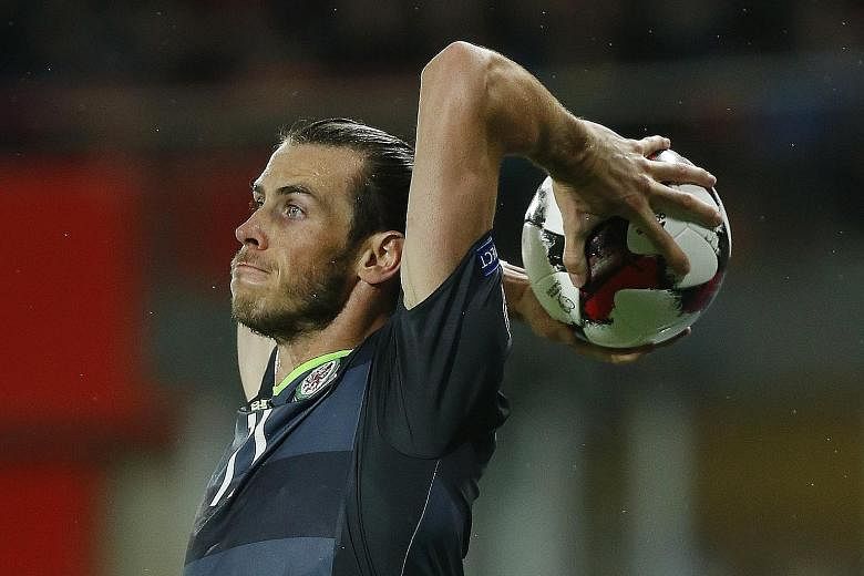Wales forward Gareth Bale preparing to launch a throw-in against Austria. His long throw in the 45th minute created one of his side's goals.