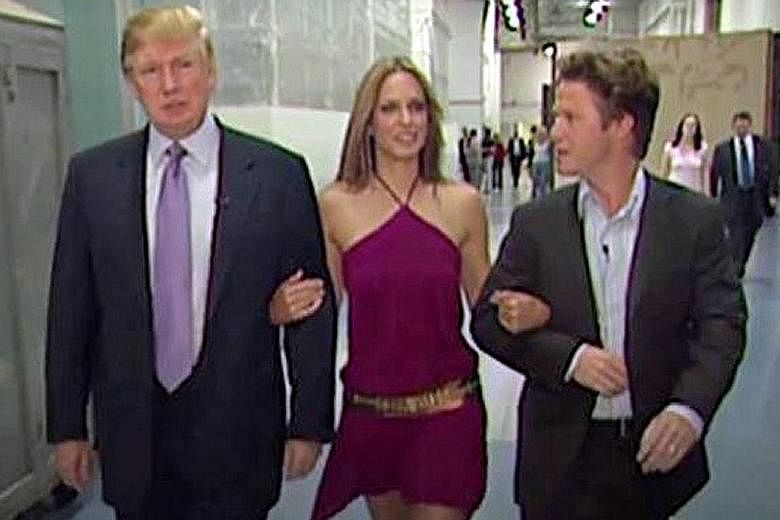 Mr Trump with actress Arianne Zucker and Mr Bill Bush in the 2005 video. Mr Bush has apologised for "playing along" in the video where Mr Trump made lewd and disrespectful comments about women.