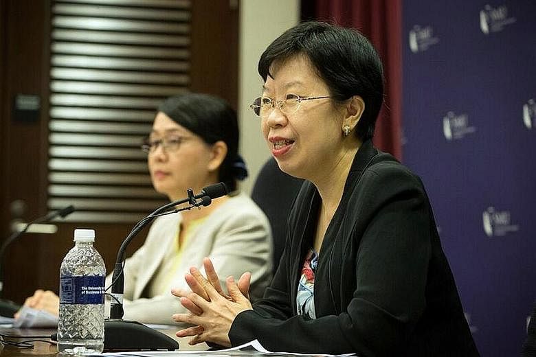 SMU provost Lily Kong (right) at a media briefing last week. She said the scholarship aims to attract students who desire a "balance between local rootedness and global exposure".