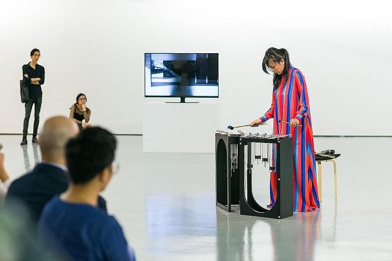 Vivian Wang playing Instrument B (Vivian), which was named after the Singapore musician. It is one of New Zealand artist Sriwhana Spong's works in the show.