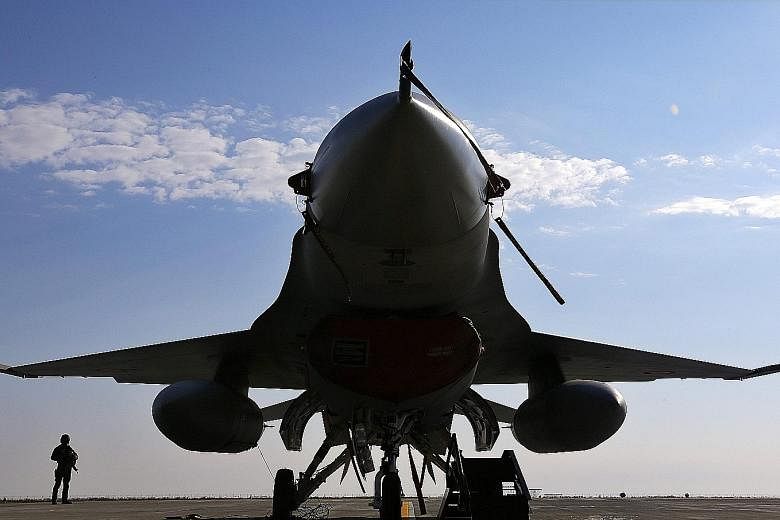 An F-16 Fighting Falcon jet fighter at the 86th Air Force Base in Borcea, Romania. The Nato member plans to buy 12 used F-16 jets from Portugal.