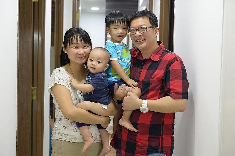 Mr Loi, a church worker, with his wife Chiam Mei Si, 32, and their sons Zhen Yi, three, and Zhen An, 101/2 months. Zhen Yi was conceived when the couple were living with Mr Loi's parents after their marriage.