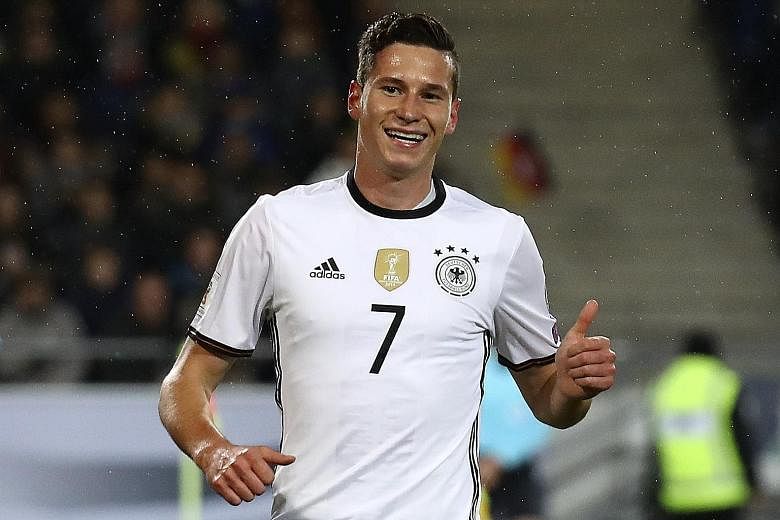 A happy Julian Draxler after opening accounts for Germany against Northern Ireland. Sami Khedira's goal wrapped up proceedings.