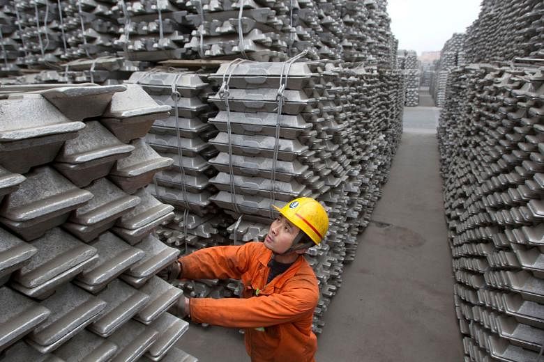 Aluminium ingots for export at Qingdao Port. Executives in medium-sized metals trading companies here say they have been approached by Bank of China International in the past few months. 