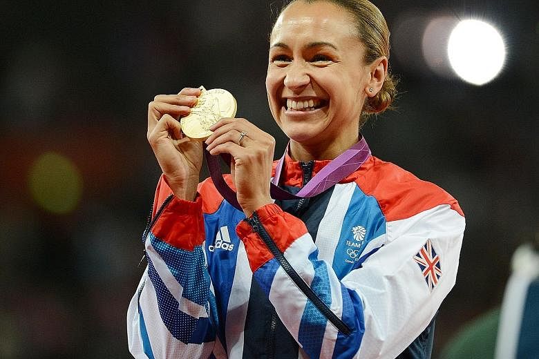 Briton Jessica Ennis-Hill celebrating her heptathlon gold at the 2012 London Olympics. She took silver at August's Rio Games.