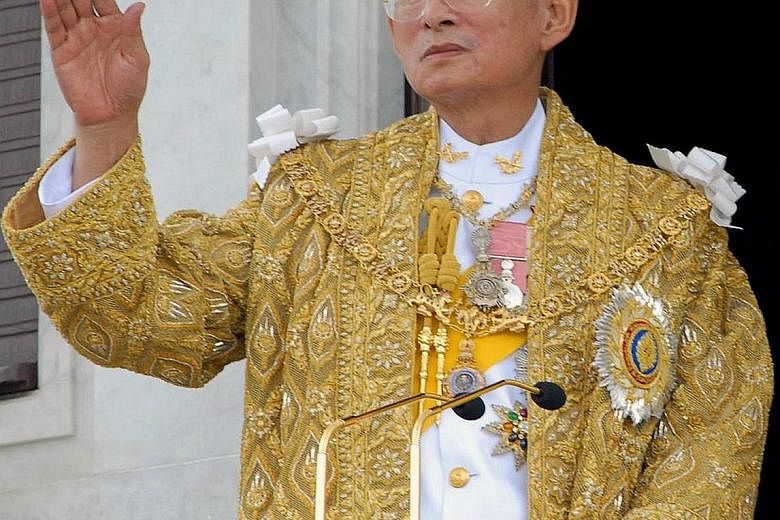 The popularity of King Bhumibol, seen in a 2006 photo, came from his travels throughout the country, especially in his younger days as King, speaking to people from all walks of life and starting projects to help the poor and marginalised.