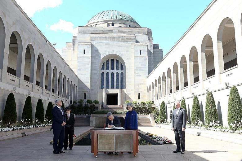 PM Lee and Mrs Lee at the Australian War Memorial in Canberra yesterday after laying a wreath. With them are the memorial's chairman Kerry Stokes (left) and director Brendan Nelson (right).
