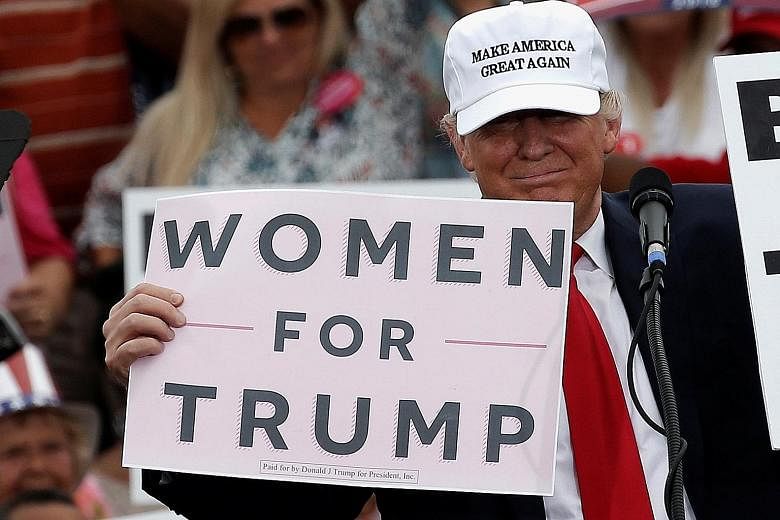 Mr Trump at a campaign rally in Lakeland, Florida, on Wednesday. Mr Trump said during his debate with Mrs Clinton on Sunday that he had not forced himself on women.